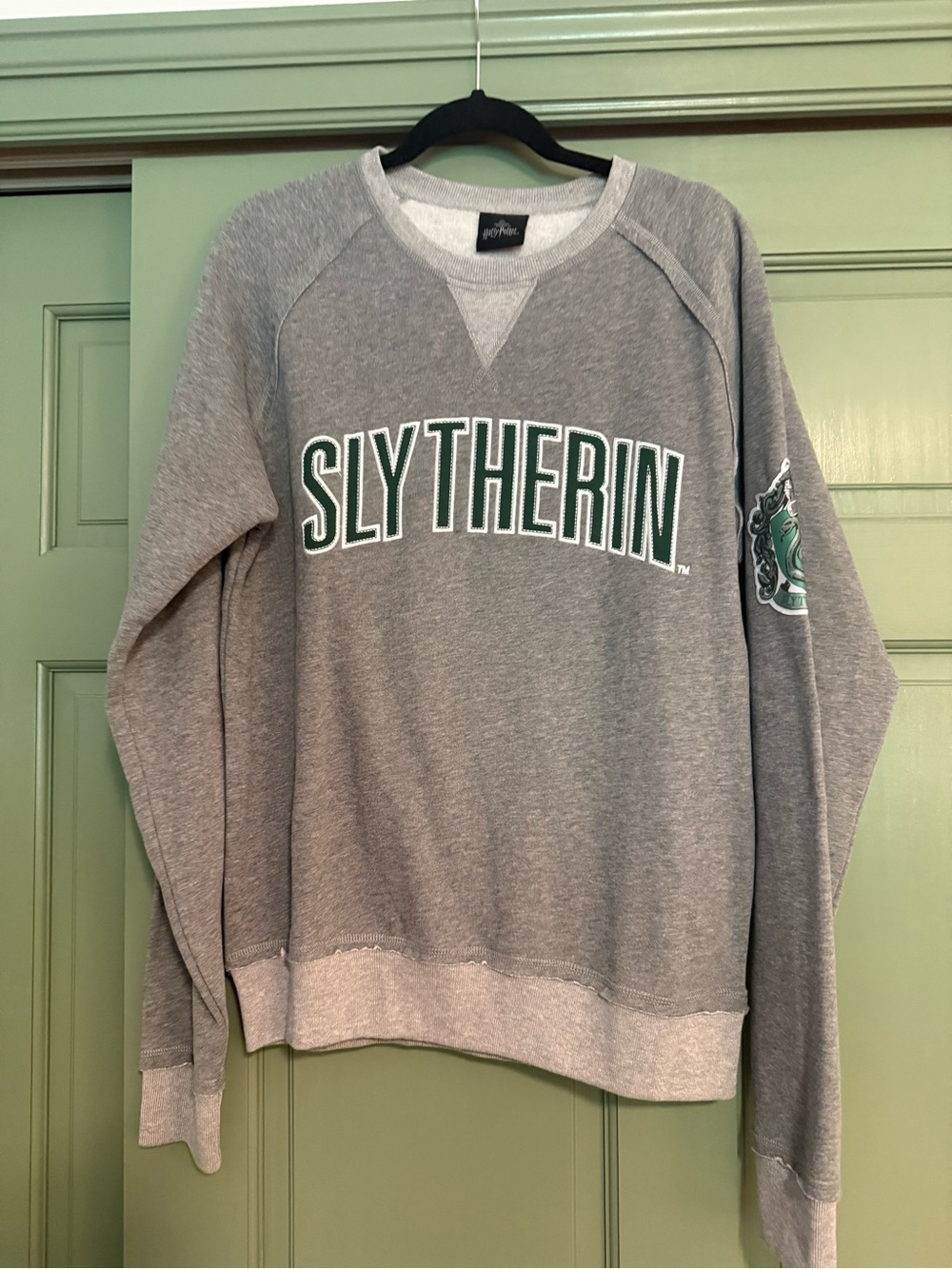 Warner Bros. Slytherin Gray Crewneck Sweatshirt with Green Lettering